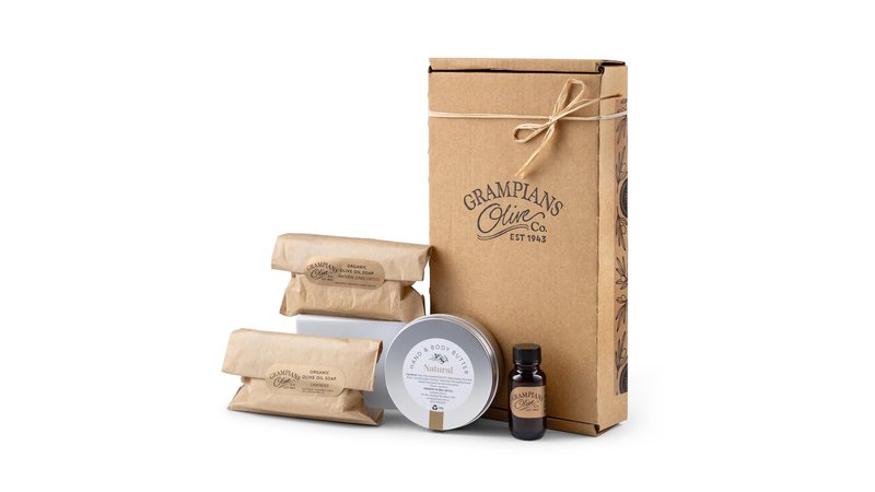 The Grampians Olive Co. organic olive oil skincare pack: body butter tin, two soap bars and a small olive oil bottle